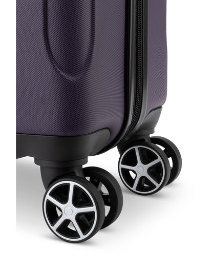 Close up of black spinner wheels on Swiss Gear Central Lite 19" Hardside Carry-on Spinner in plum