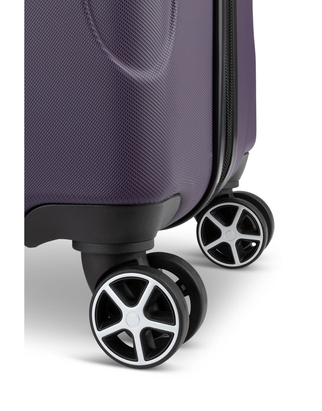 Close up of black spinner wheels on Swiss Gear Central Lite 28" Hardside Expandable Spinner in plum