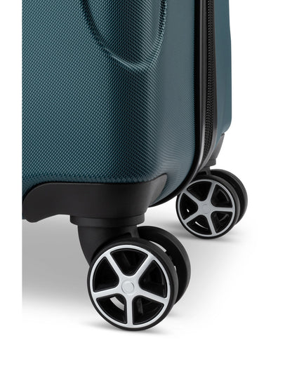 Close up of black spinner wheels on Swiss Gear Central Lite 28" Hardside Expandable Spinner in teal