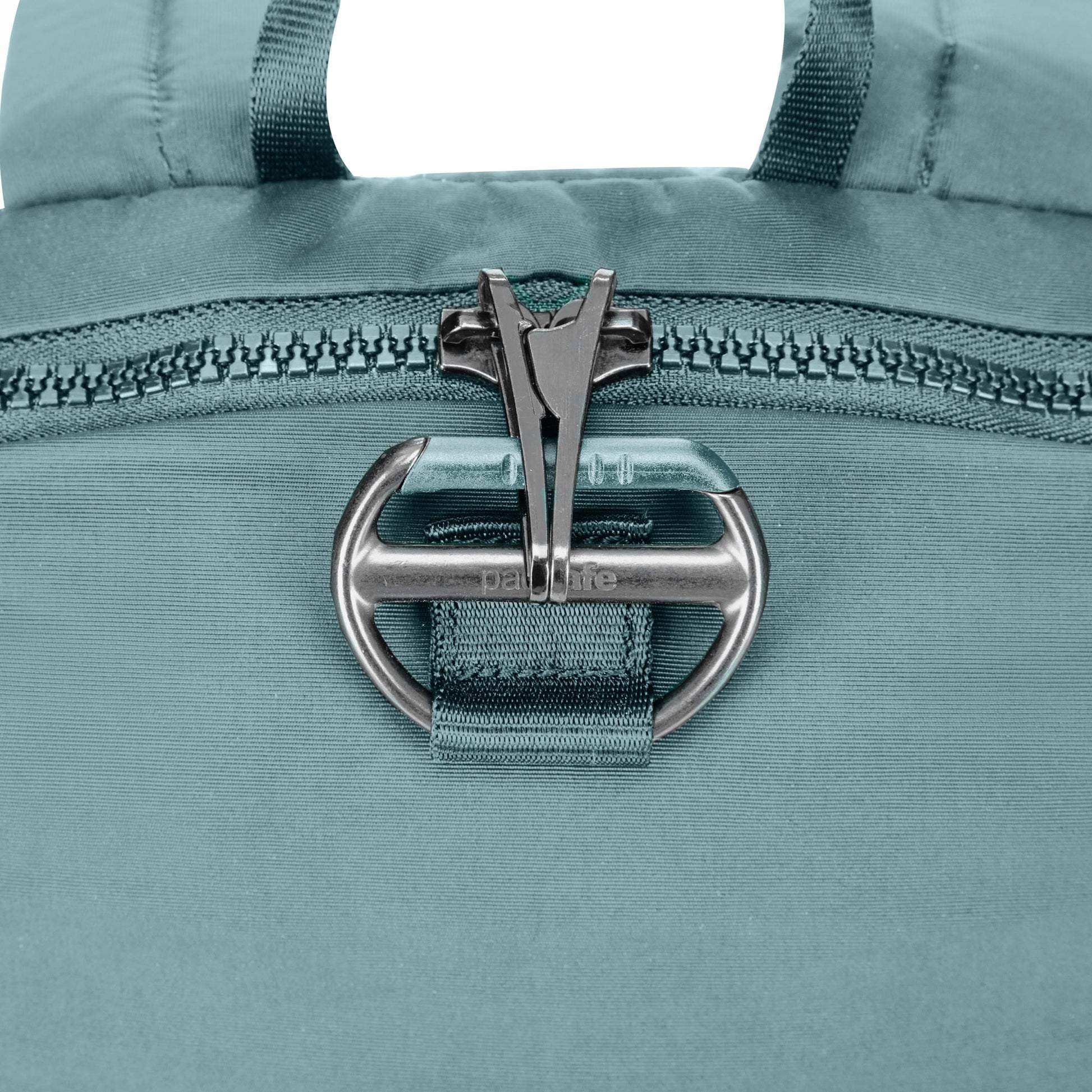 Close up of lockable zipper pulls on fresh mint Pacsafe® CX Anti-theft 8L Backpack Petite