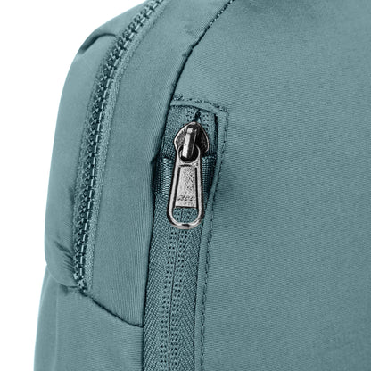 Close up of secured zipper on side of fresh mint Pacsafe® CX Anti-theft 8L Backpack Petite