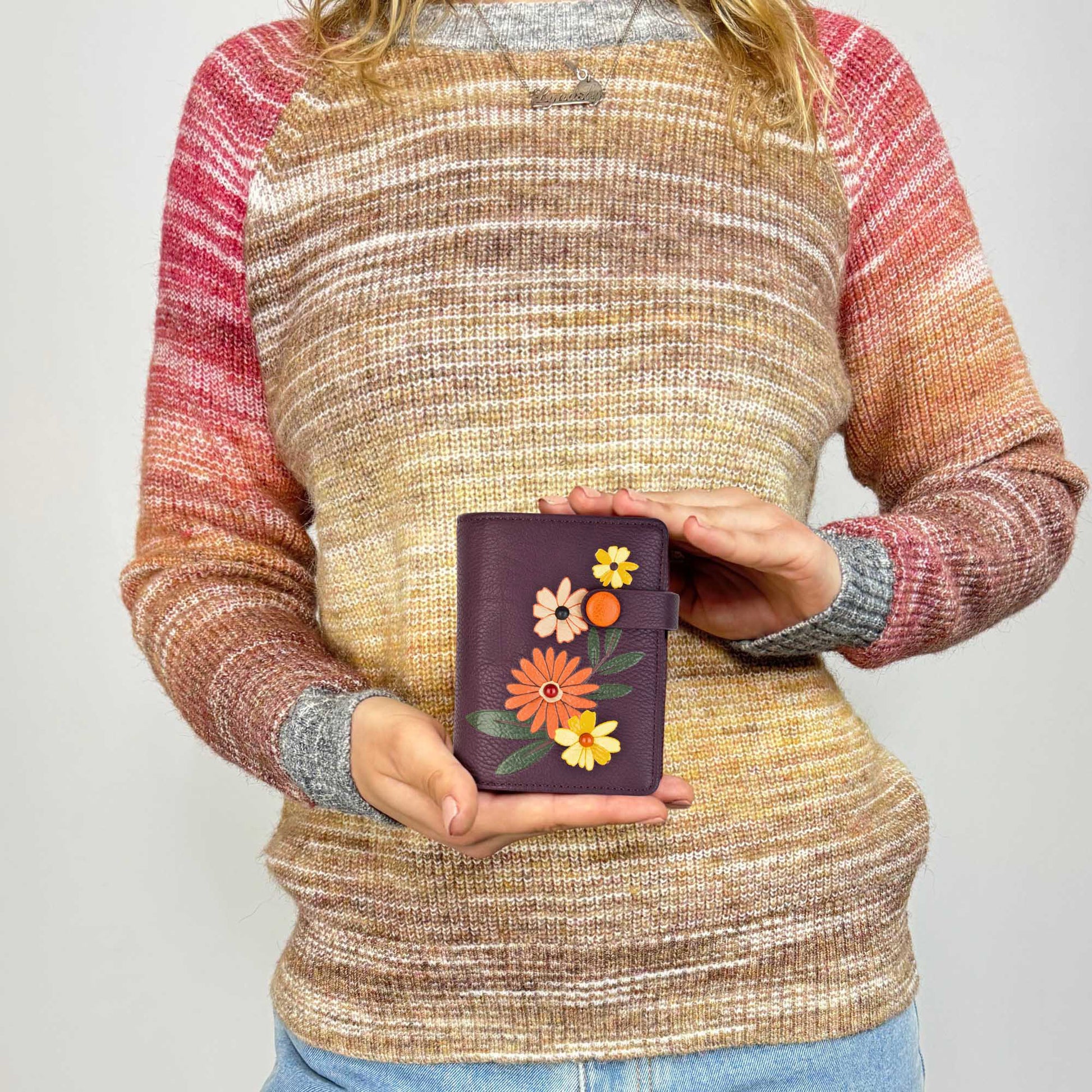 Woman holding the purple Espe Daliah Small Wallet, front view