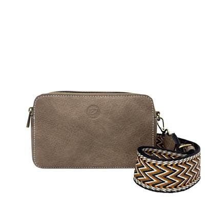 Espe Emerson Crossbody in taupe vegan leather with zip top and detachable zigzag strap shown in front.