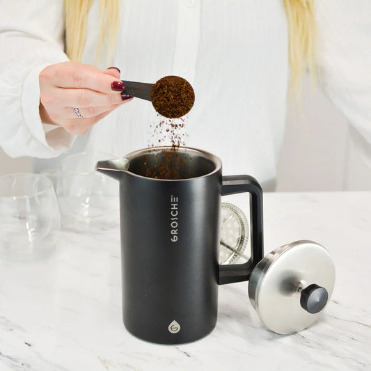 Product Image – Matte black Grosche Dublin French press with mesh filter and coffee grounds