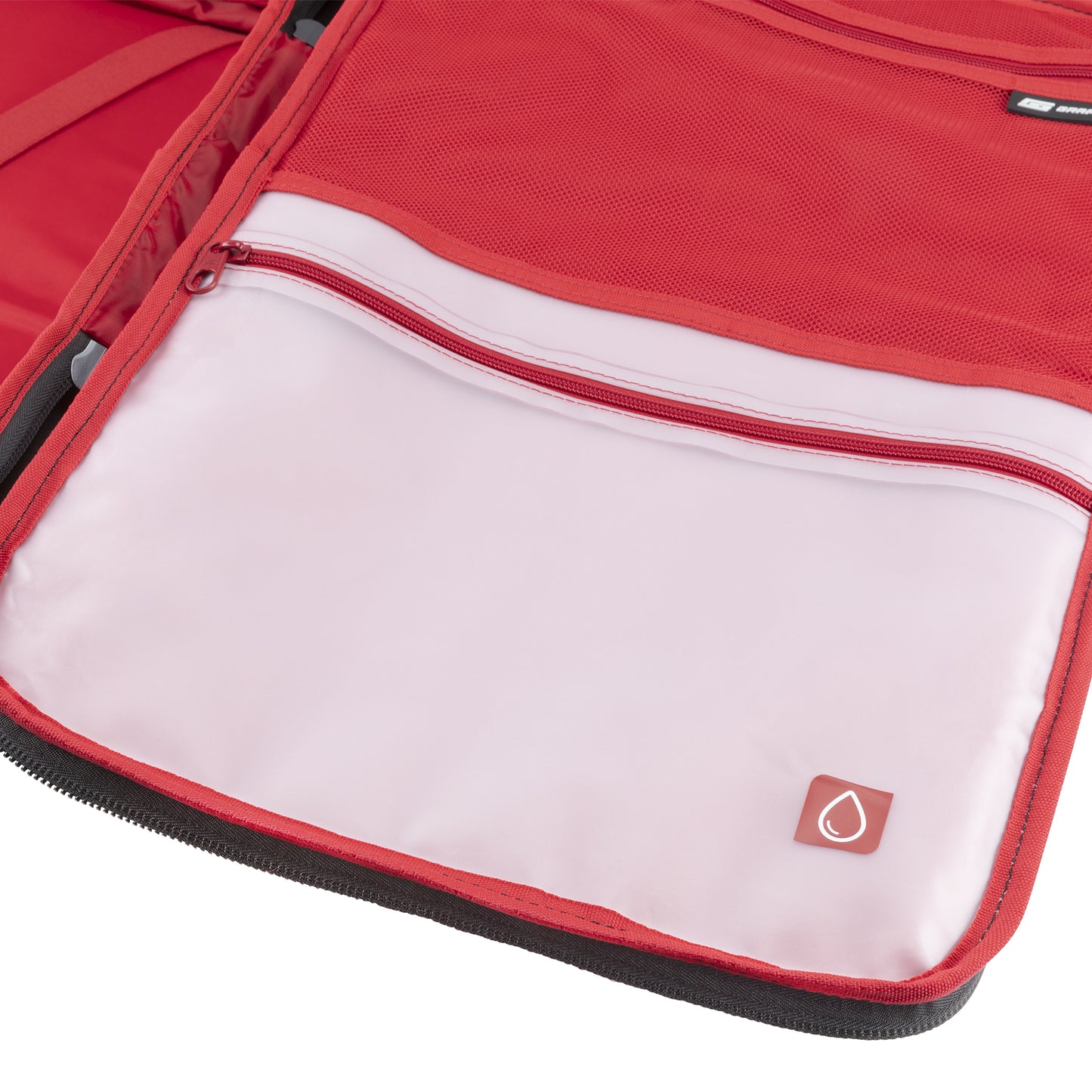 Open Graphite Metamorph Convertible Travel Backpack showing an interior pocket with red zipper and water icon.