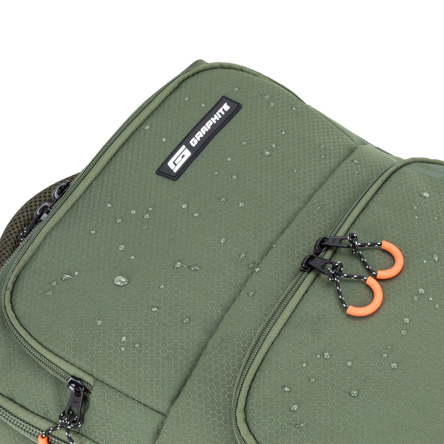Close-up of Graphite Metamorph Convertible Travel Backpack with water droplets, black zippers, and orange pull tabs.