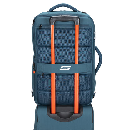 Graphite Metamorph Convertible Travel Backpack by Graphite with laptop compartment, stacked on a suitcase.