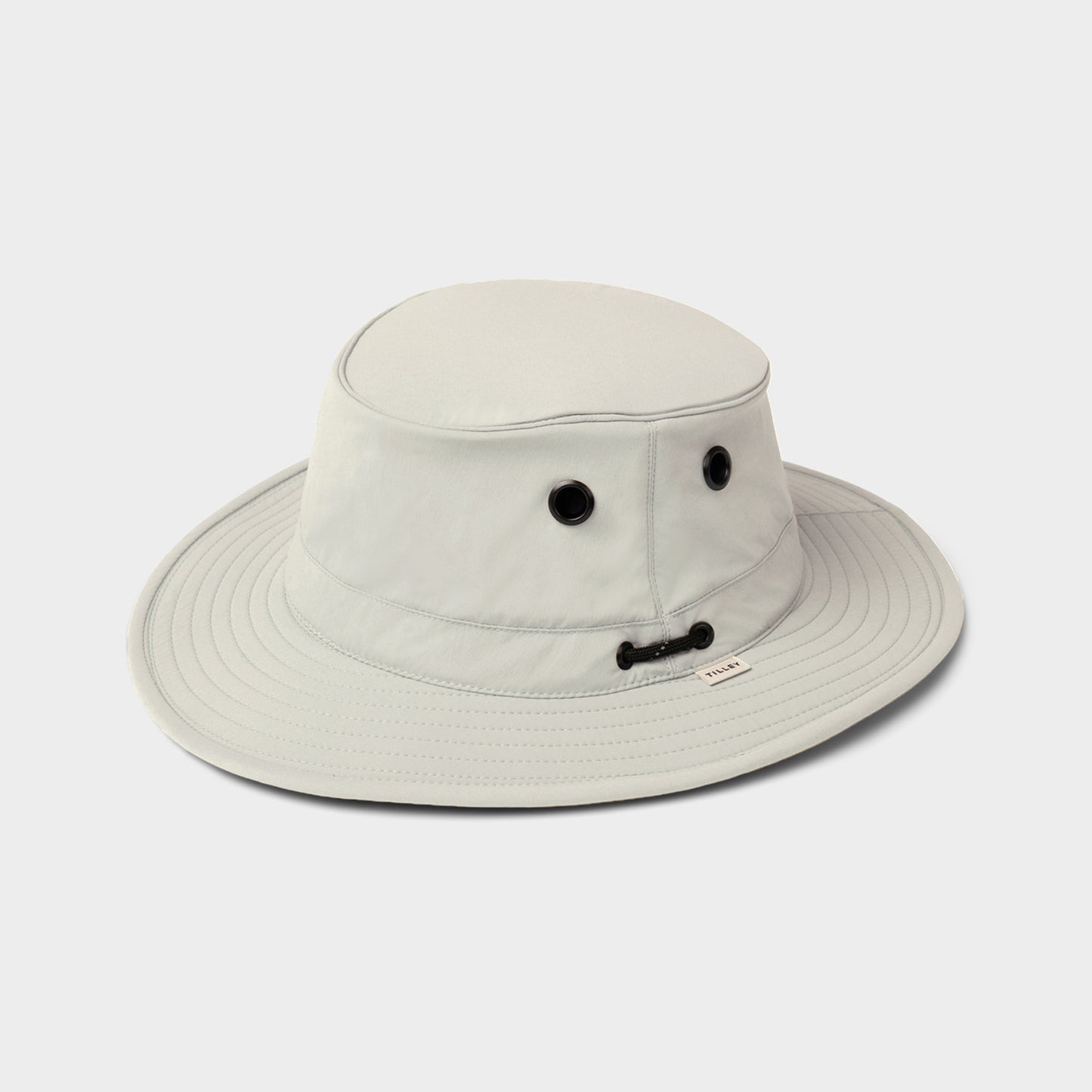 The Tilley T5 Adventure Ultralight Hat in light gray offers UPF 50+ sun protection and a chin cord.