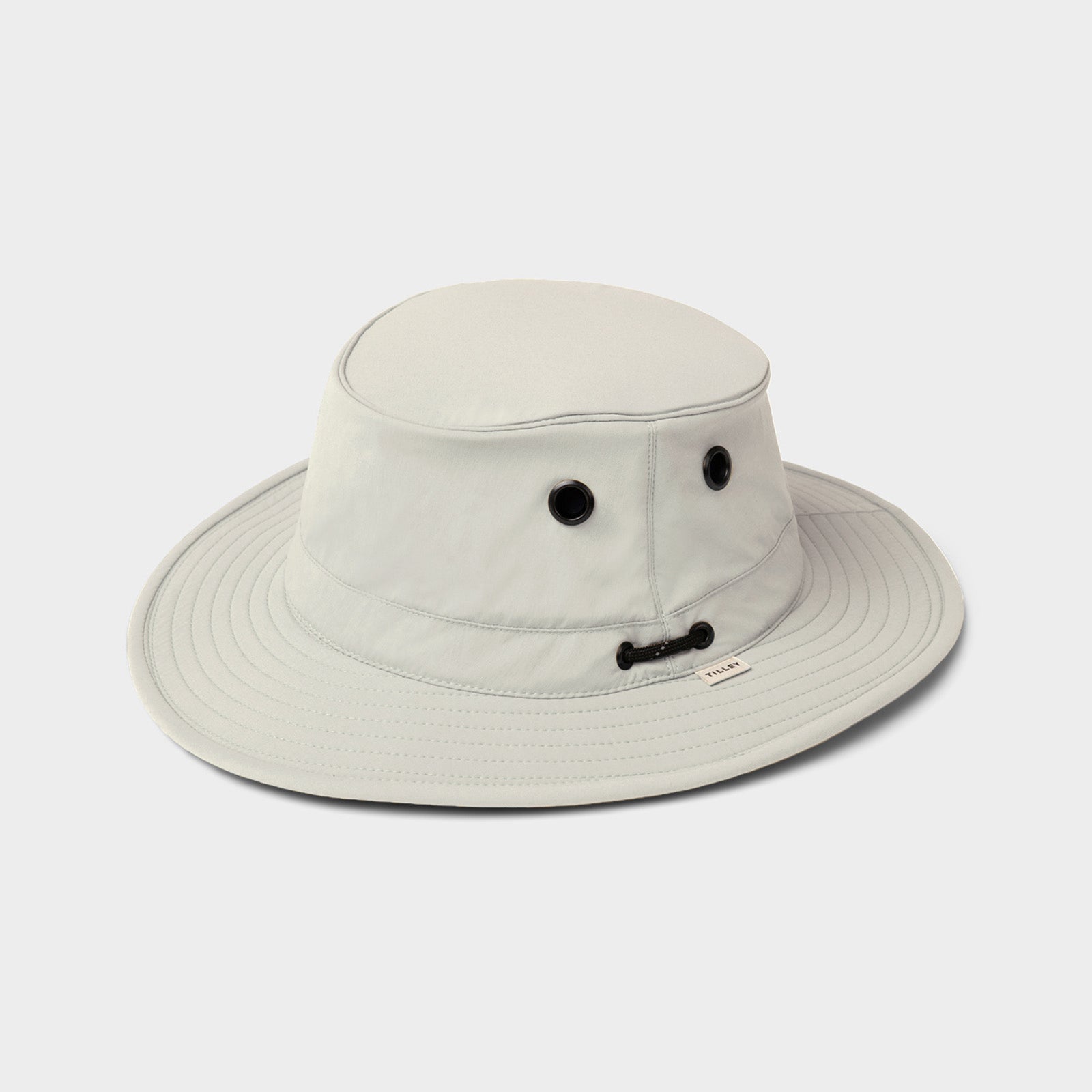 The Tilley T5 Adventure Ultralight Hat in light gray offers UPF 50+ sun protection and a chin cord.