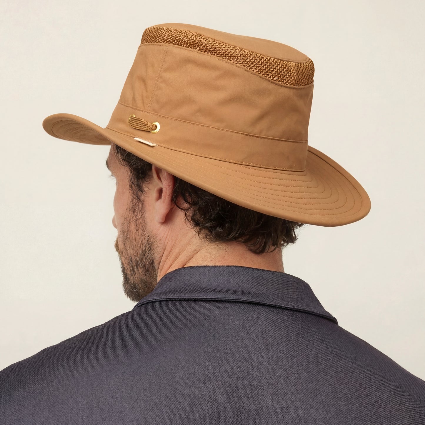 Man wearing a Tilley LTM5 Airflo® Hat, shown from the back against a neutral background.