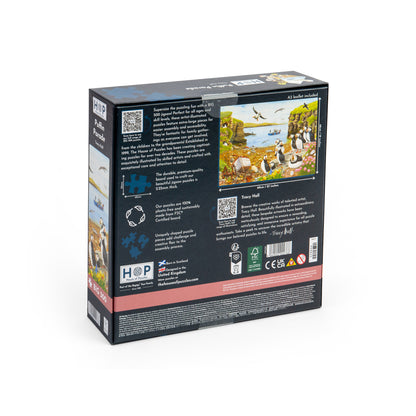 Back of a House of Puzzles BIG 500 Piece Jigsaw Puzzle - Puffin Parade - ONLINE ONLY box showing puffins on a coast.