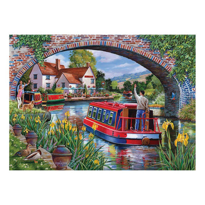 A red canal boat steers toward a brick bridge in this House of Puzzles BIG 500 Piece Jigsaw Puzzle - Over & Under.