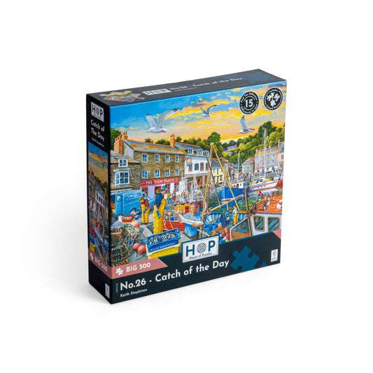 Product Image – Box for a House of Puzzles BIG 500 Piece Jigsaw Puzzle - Catch of the Day featuring a coastal harbor scene.