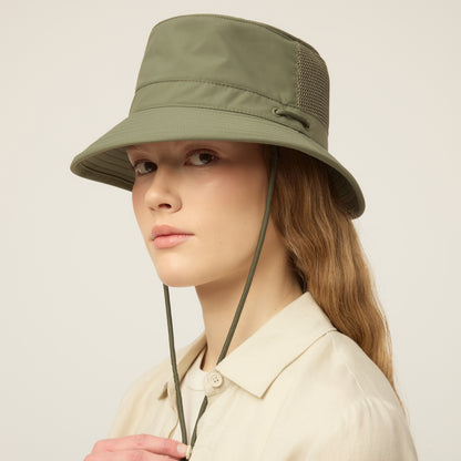 Person wearing a thyme green Tilley LTM1 Airflo® Bucket Hat with chin strap, head turned slightly.
