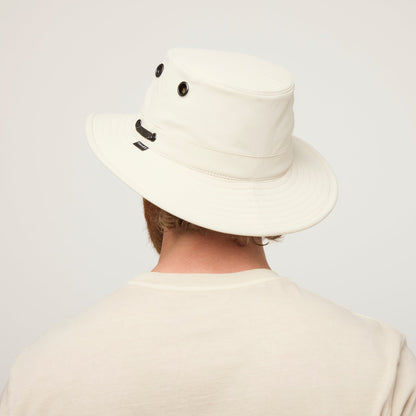 Person wearing a Tilley T5 Adventure Ultralight Hat for UPF 50+ sun protection, viewed from behind.