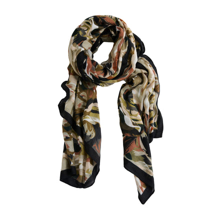 Howard’s Celina Rose Print Lightweight Scarf with a green, brown, and black floral design and a black border.