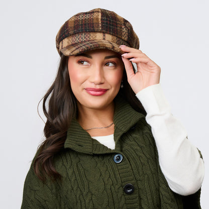 A person wearing a brown tartan plaid Howard’s Tartan Plaid Newsboy Hat.