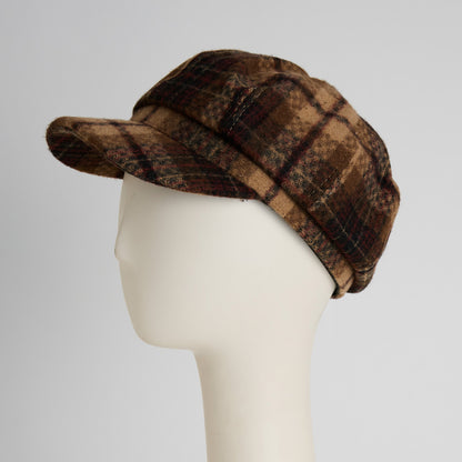 Howard’s Tartan Plaid Newsboy Hat in brown tartan on a mannequin head, a structured vintage-inspired accessory.