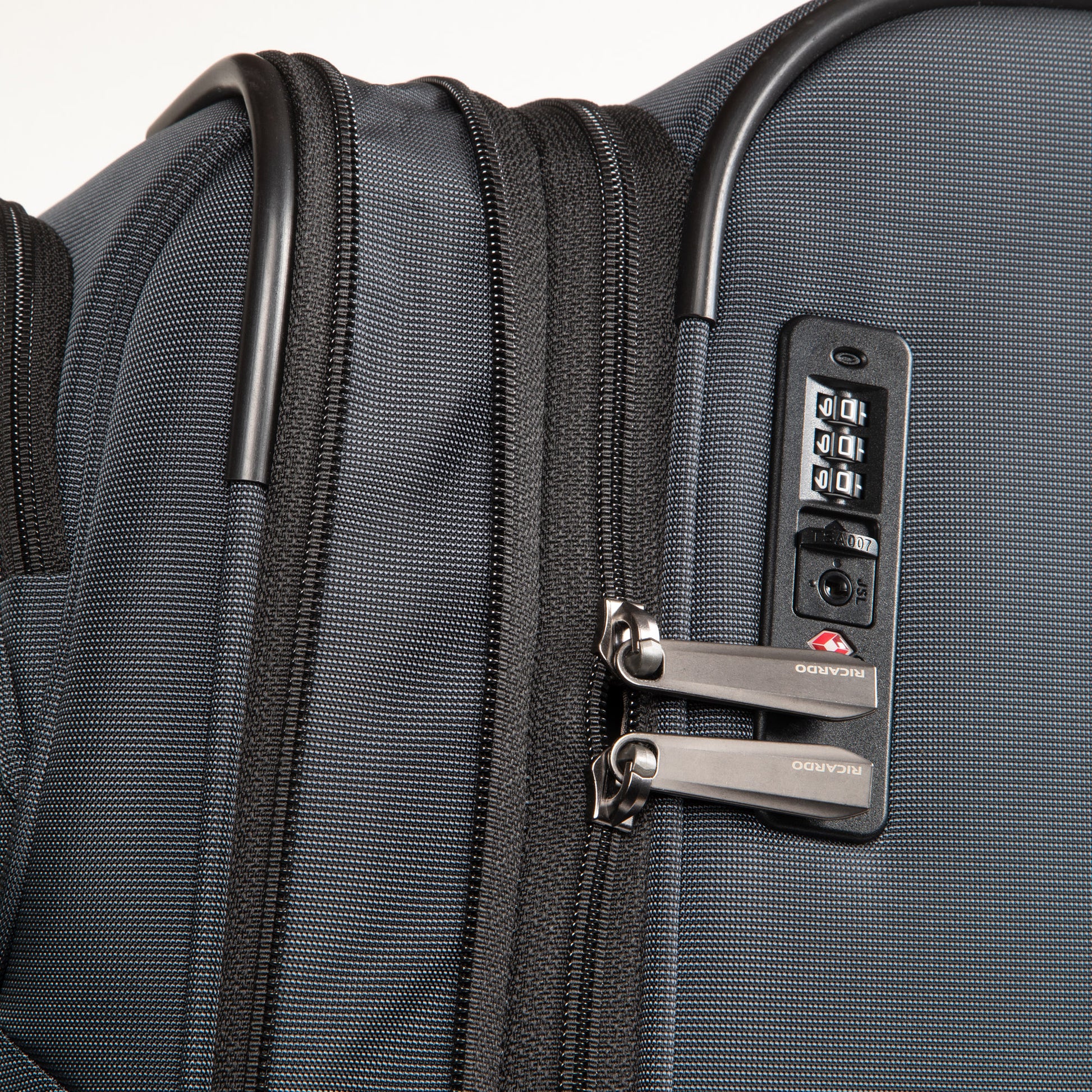 Close-up of the Ricardo Beverly Hills Montecito 3.0 Softside Medium Spinner with TSA lock and dual zipper pulls.