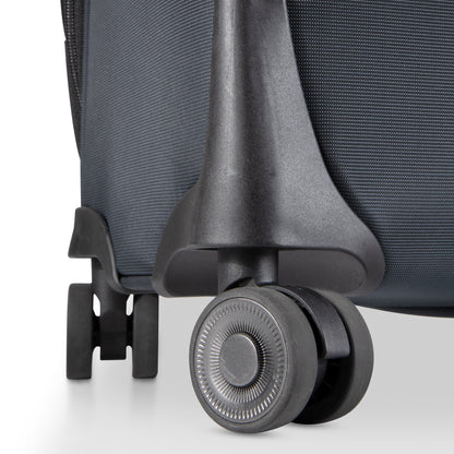 Close-up of two black wheels on the Ricardo Beverly Hills Montecito 3.0 Medium Check-In Spinner luggage.