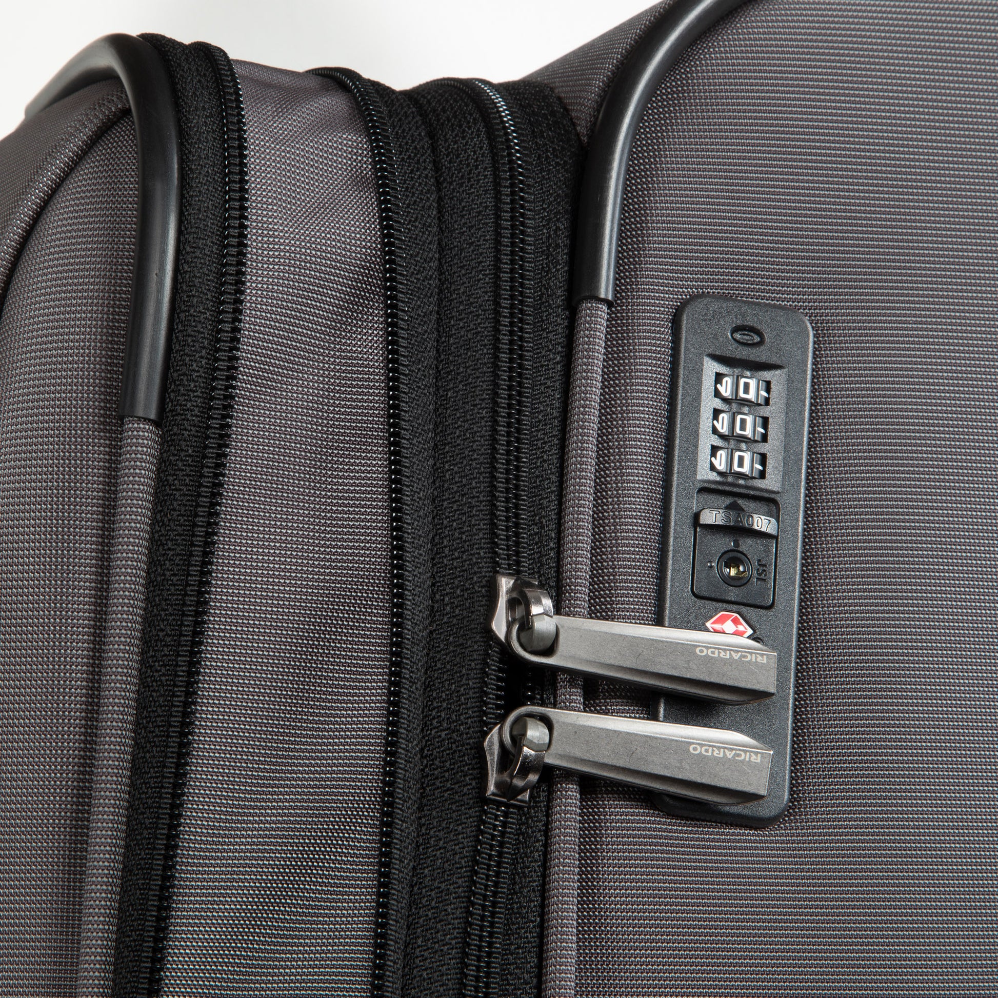 Close-up of the Ricardo Beverly Hills Montecito 3.0 Large Expandable Spinner with combo lock and secure zippers.