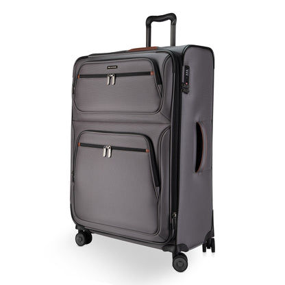 Ricardo Beverly Hills Montecito 3.0 large gray expandable spinner with two front zip pockets, on white background.