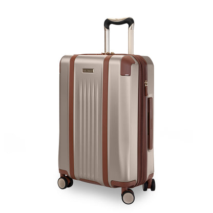 Ricardo Beverly Hills Montecito 2.0 21" beige hardside spinner with brown accents and telescopic handle.