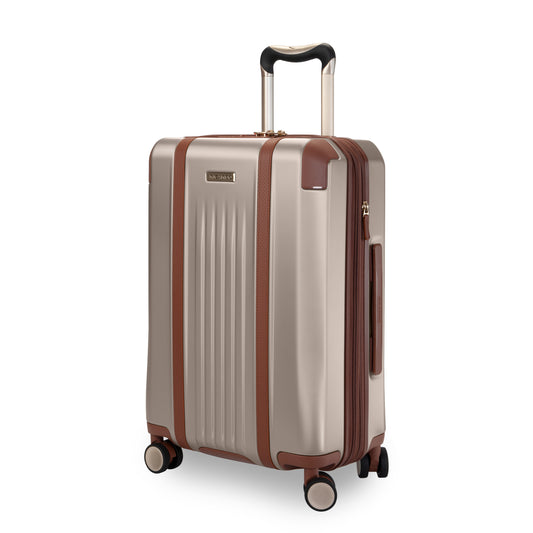 Product Image – Ricardo Beverly Hills Montecito 2.0 21" beige hardside spinner with brown accents and telescopic handle.