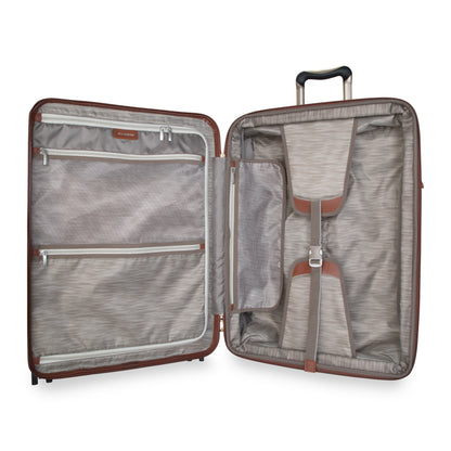 Ricardo Beverly Hills Montecito 2.0 25" hardside spinner open with beige interior, zippered pockets, and straps.