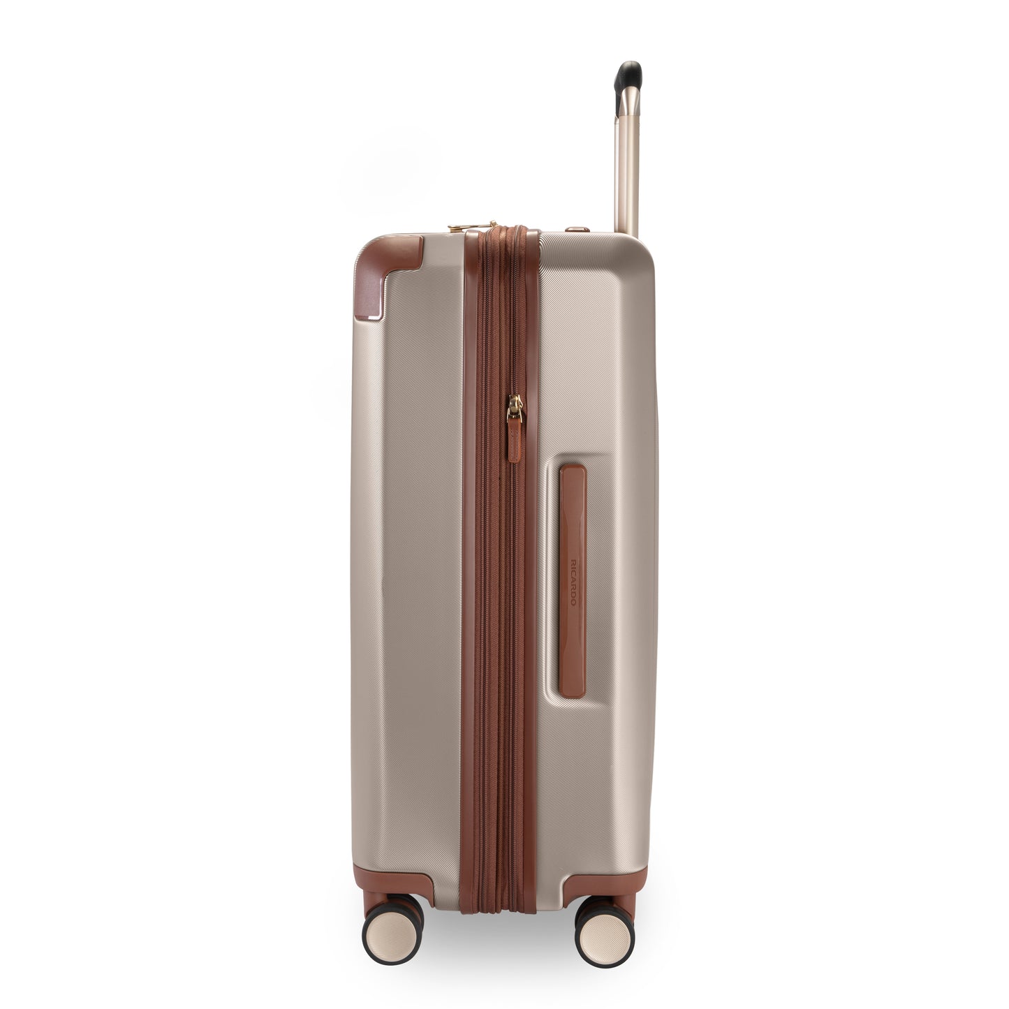 The Ricardo Beverly Hills Montecito 2.0 25" hardside spinner stands upright on four wheels, beige with brown accents.