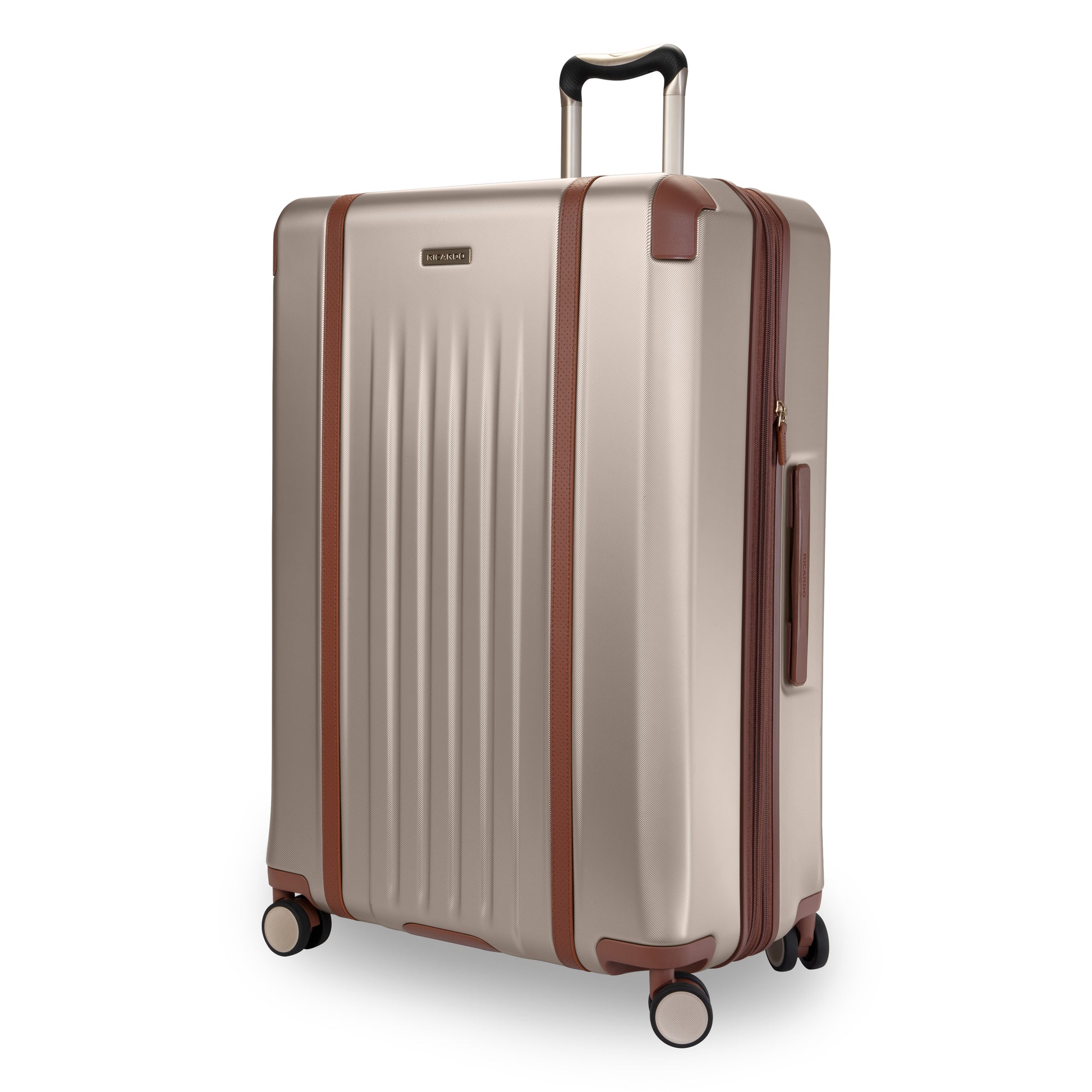 Ricardo Beverly Hills Montecito 2.0 29" beige hardside spinner with brown accents and telescopic handle.