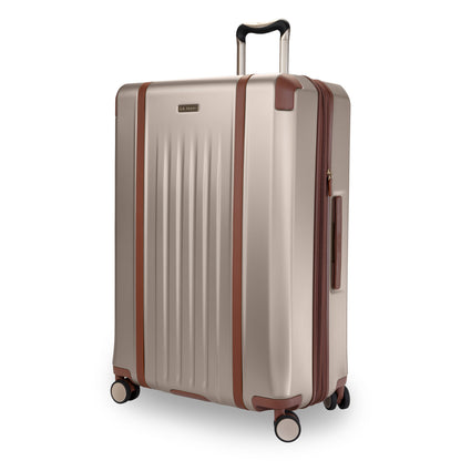 Ricardo Beverly Hills Montecito 2.0 29" beige hardside spinner with brown accents and telescopic handle.