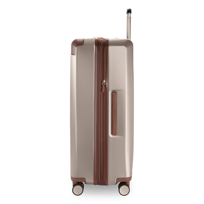 Ricardo Beverly Hills Montecito 2.0 29" beige hardside spinner with brown trim on four wheels, side view.