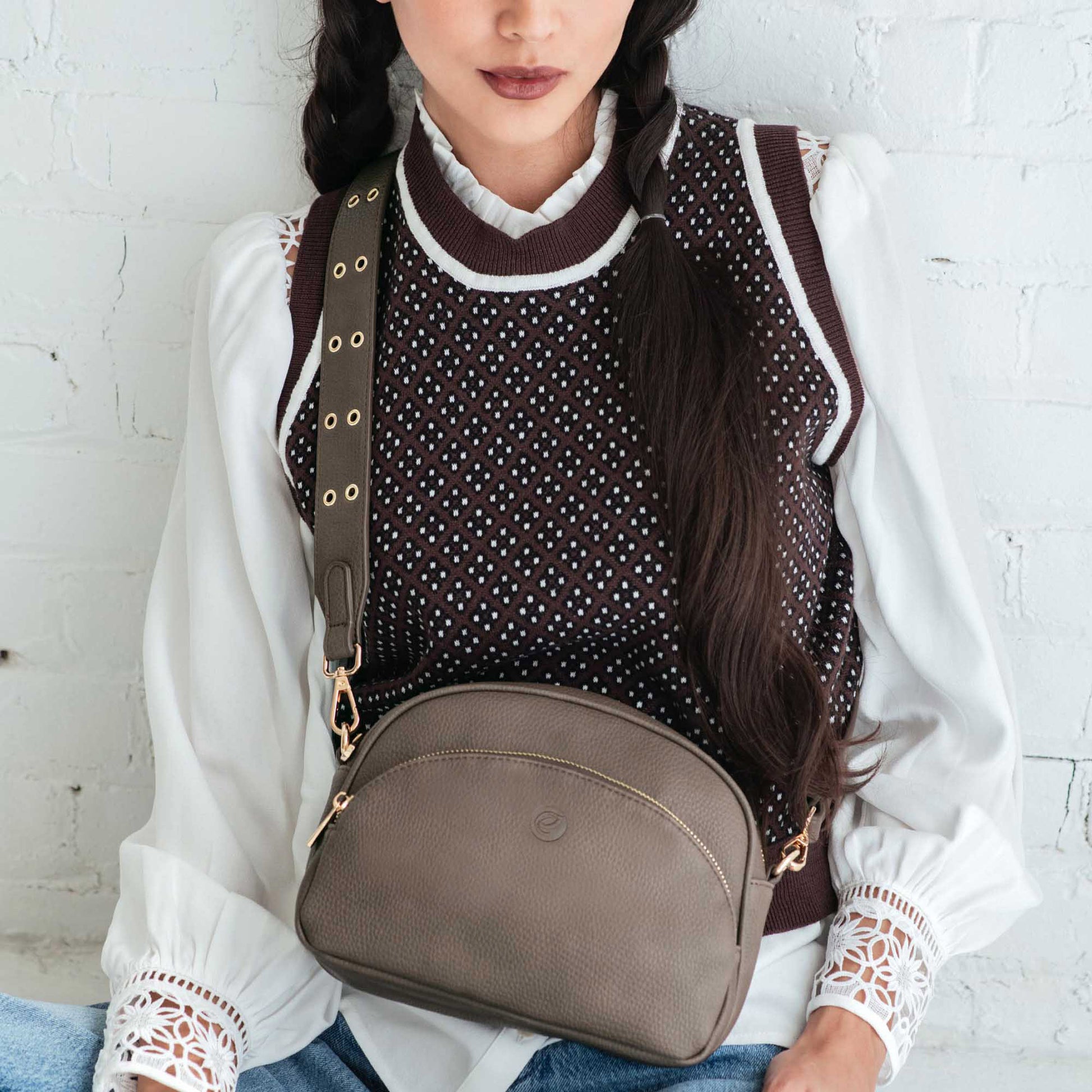 Woman wearing white shirt and brown sweater vest with grey Espe Maddison Crossbody