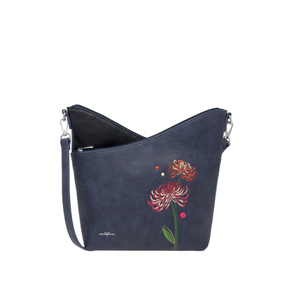 The Espe Mae Crossbody by Espe is a navy floral bag with silver hardware and cruelty-free materials.