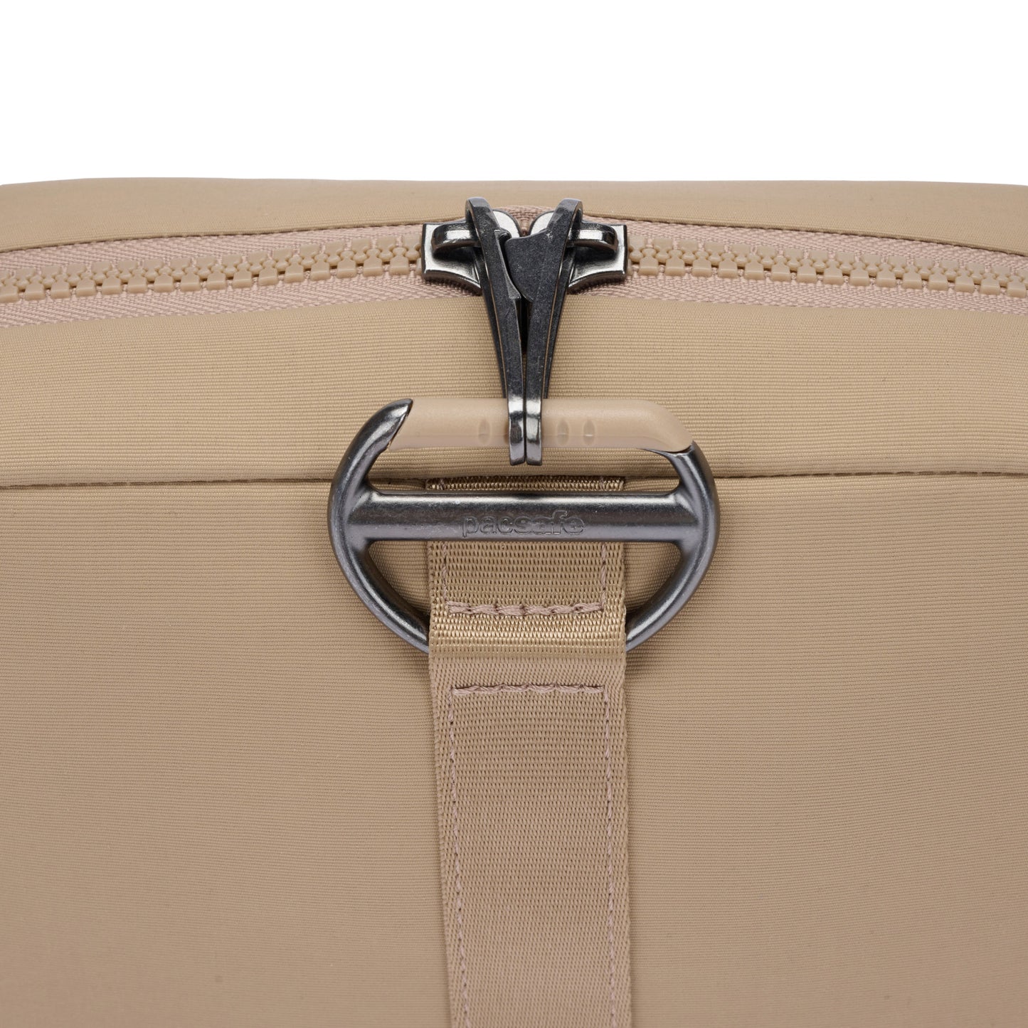 Close-up of the Pacsafe® CX Anti-theft Square Crossbody with RFIDsafe pockets, metal zipper, and silver buckle.