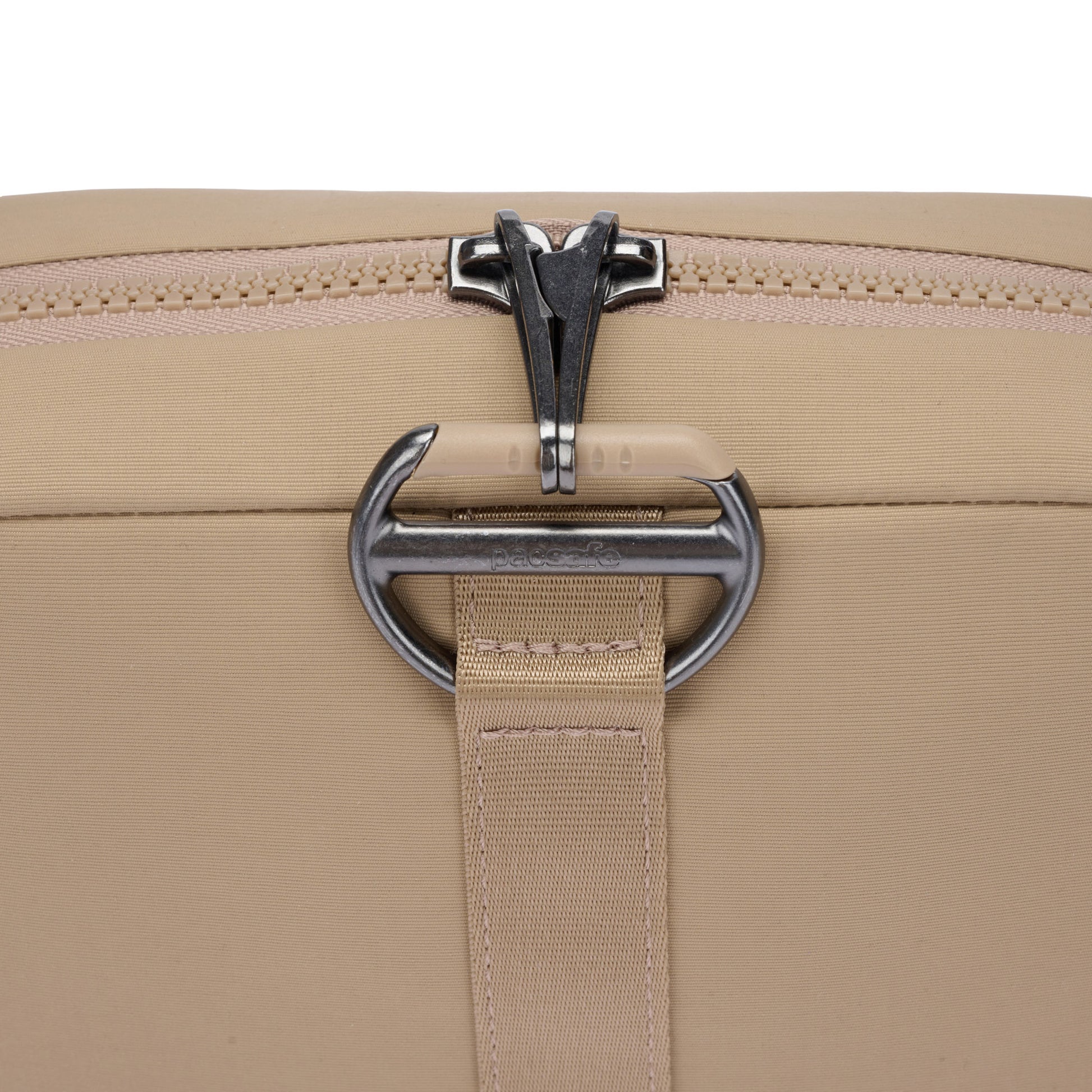 Close-up of the Pacsafe® CX Anti-theft Square Crossbody with RFIDsafe pockets, metal zipper, and silver buckle.