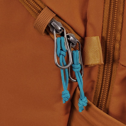 Close up of zipper pulls on canyon Pacsafe® ECO 18L Anti-theft Backpack