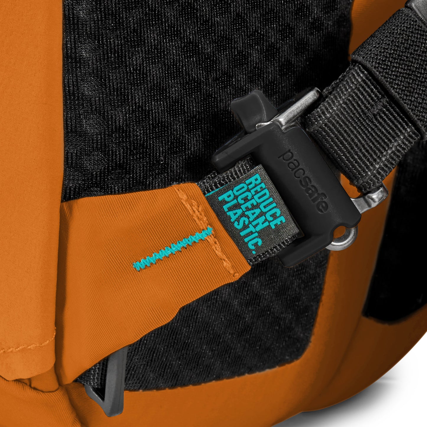 Close up of security clip on one shoulder strap of canyon Pacsafe® ECO 25L Anti-theft Backpack