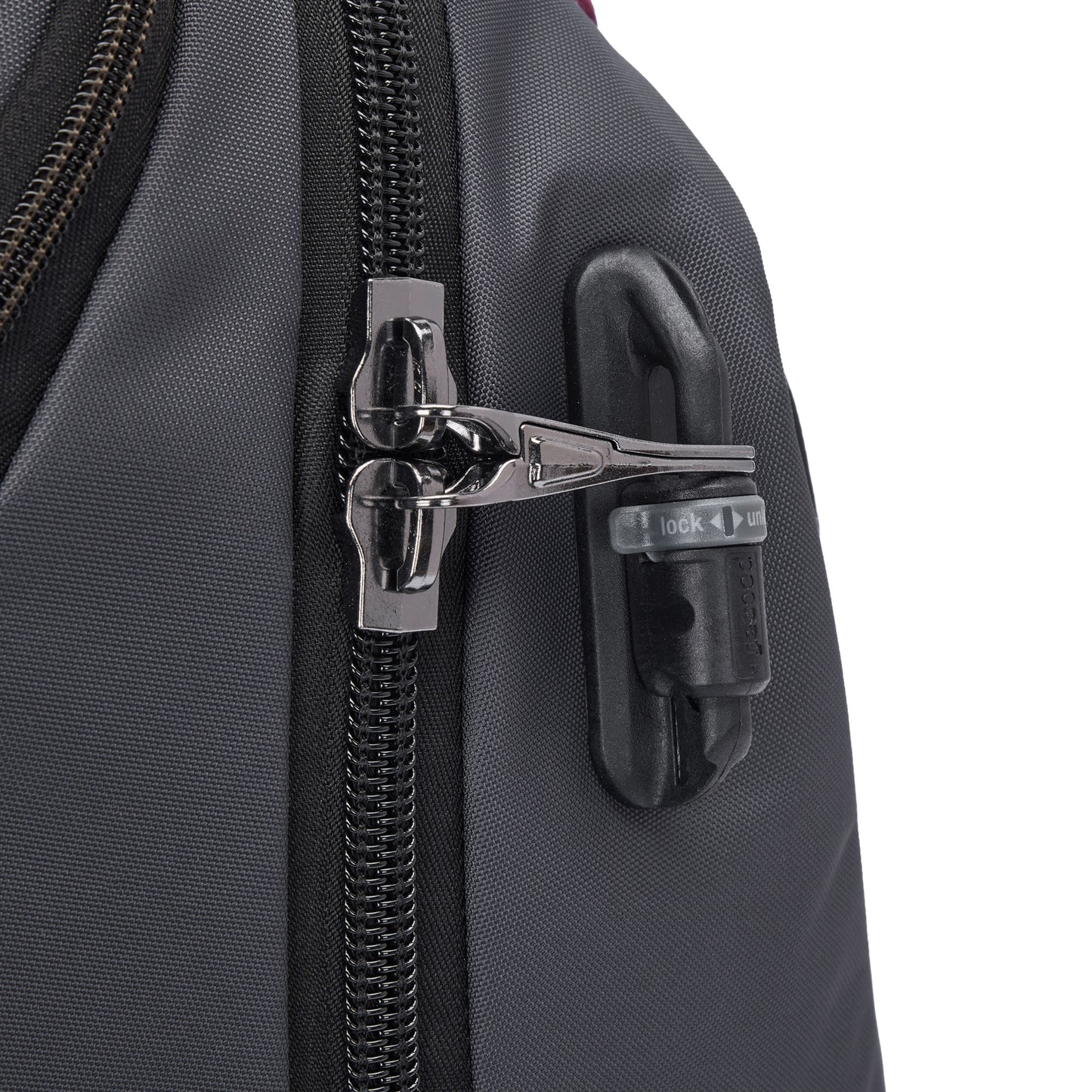 A close-up of the Pacsafe® EXP 28L Anti-Theft Backpack’s zipper with a black and silver combination lock.
