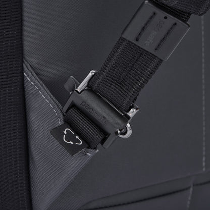 Close-up of a Pacsafe® EXP 28L Anti-Theft Backpack strap with a plastic buckle and visible stitching.