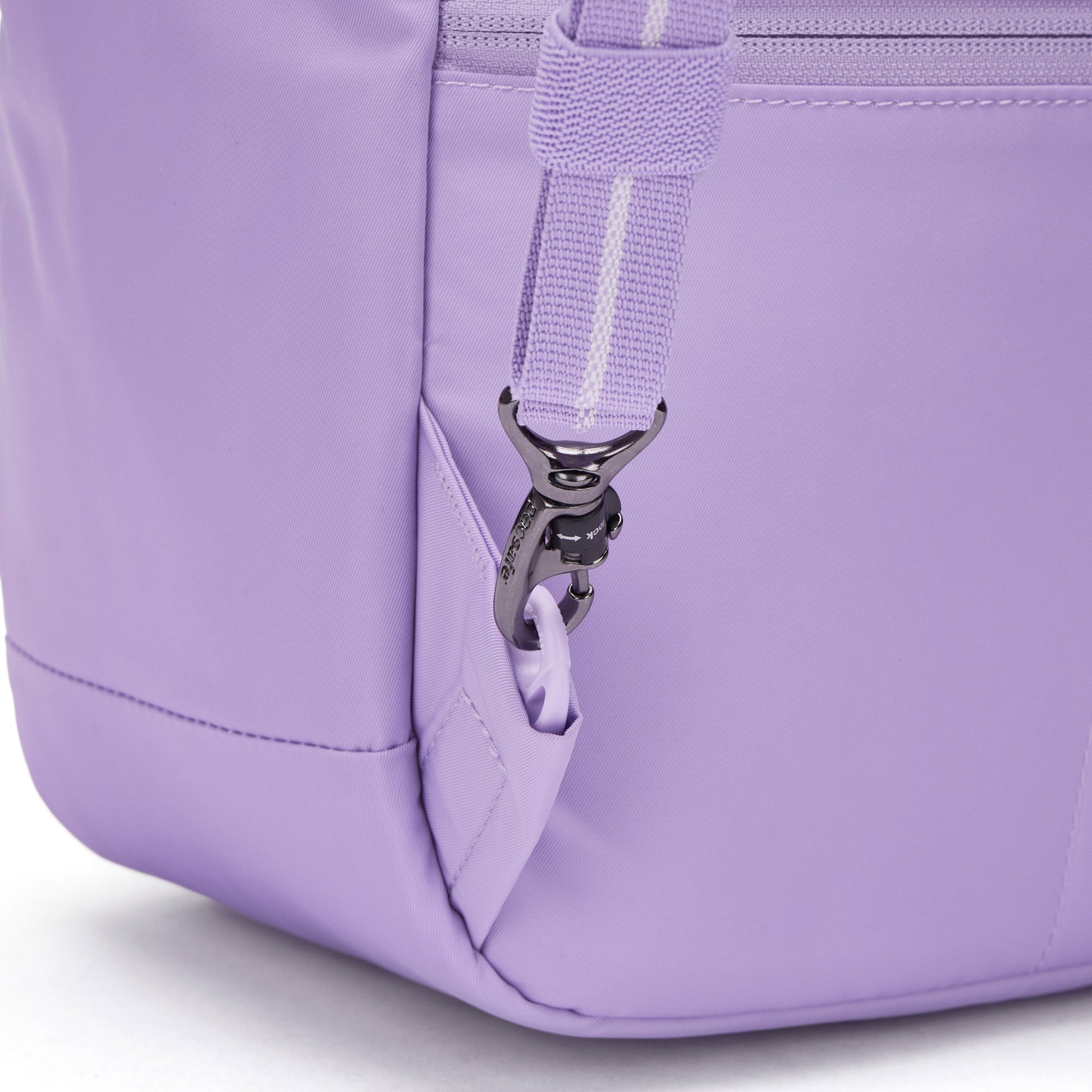 Close-up of Pacsafe® GO 15L Anti-theft Backpack, showing metal clasp attaching the shoulder strap.