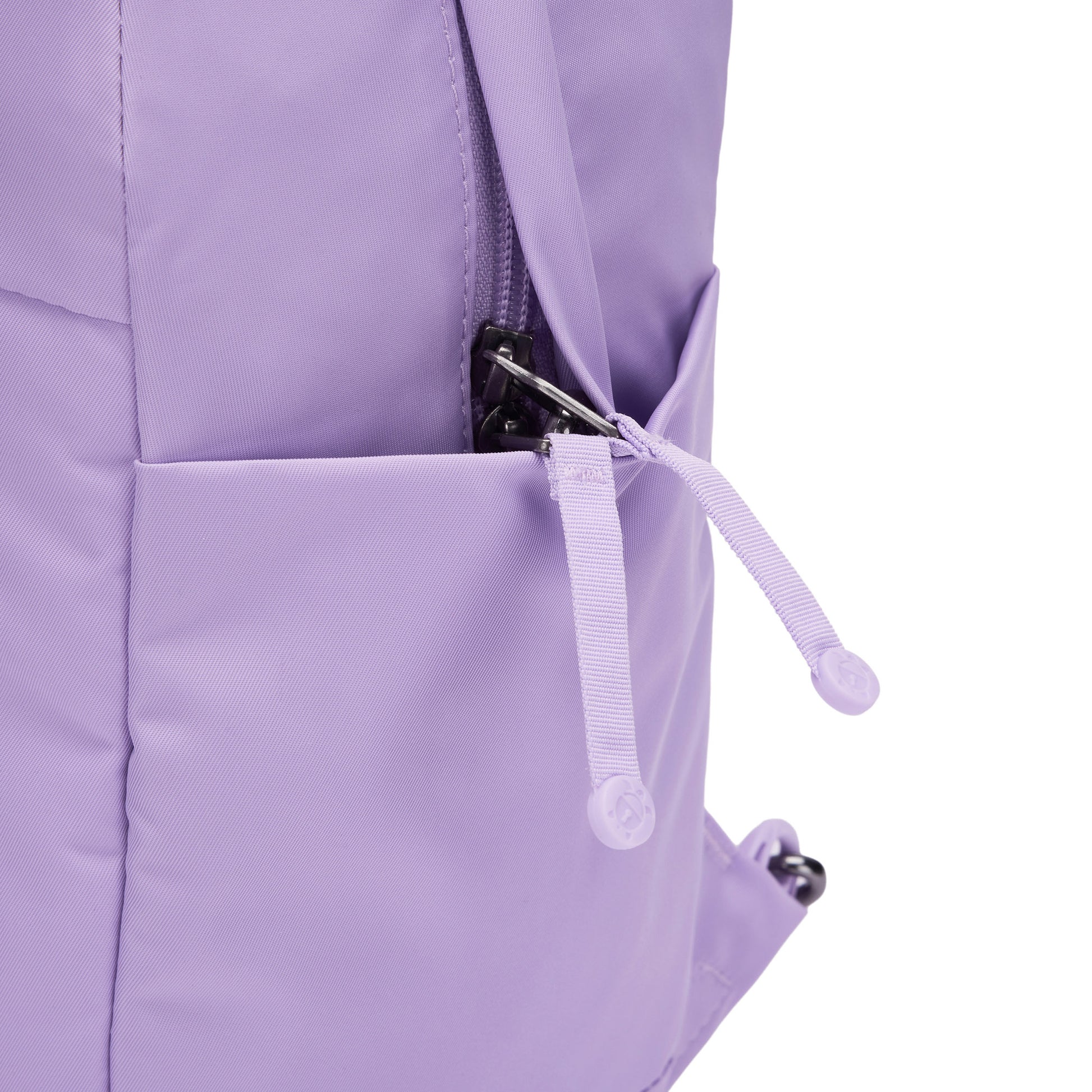 Close-up of a Pacsafe® GO 15L Anti-theft Backpack pocket, zipper and pull tab partially open.