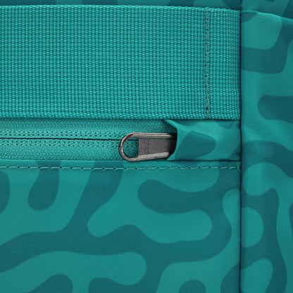 Close up of security pocket on back with tucked zipper pull for added security.