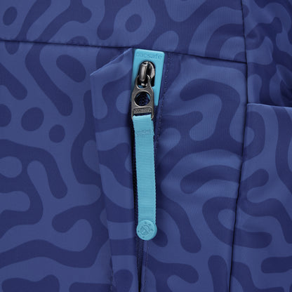 Close-up of turquoise zip pull on Pacsafe® GO 15L Anti-theft Backpack with patterned blue fabric.