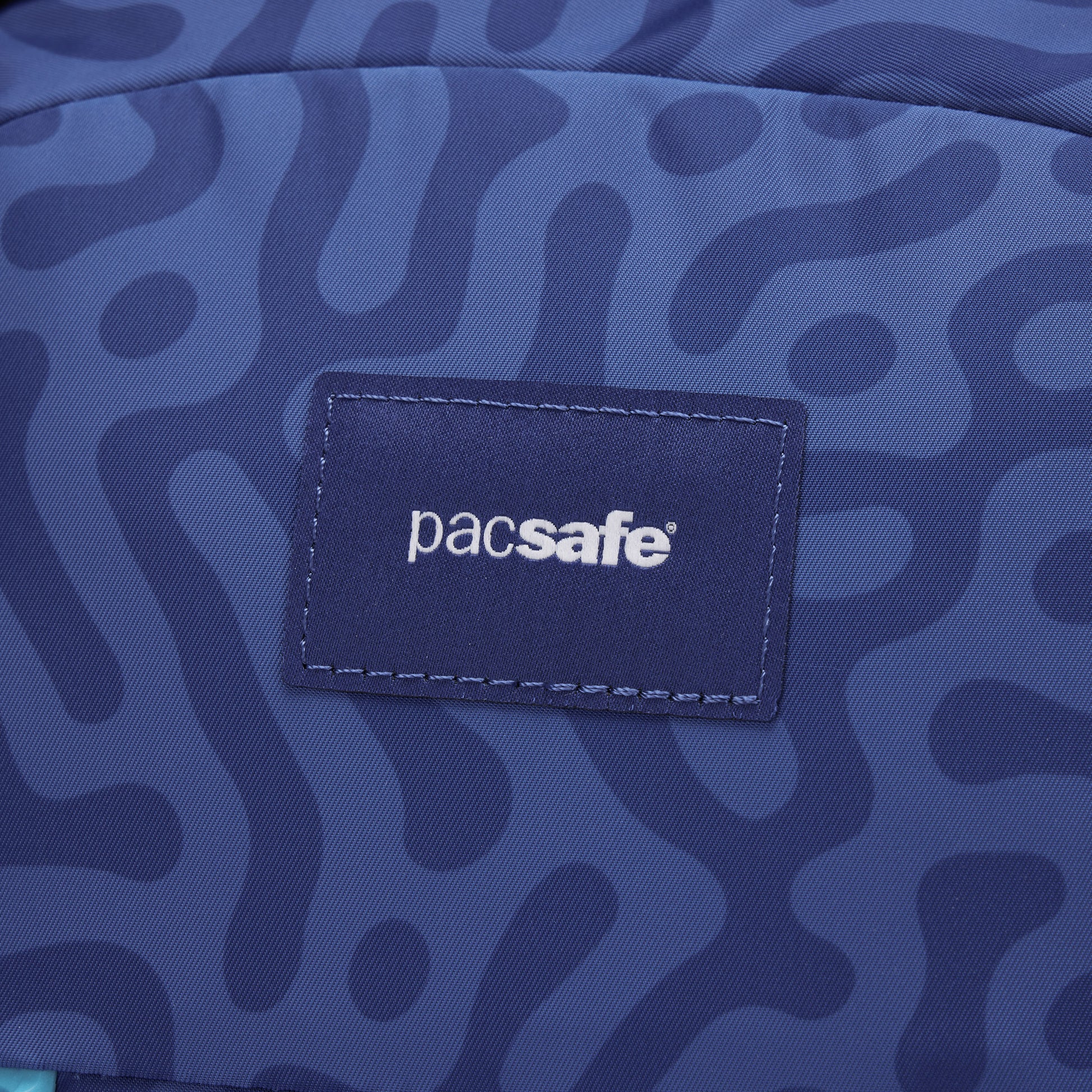 Close up of Pacsafe logo patch.