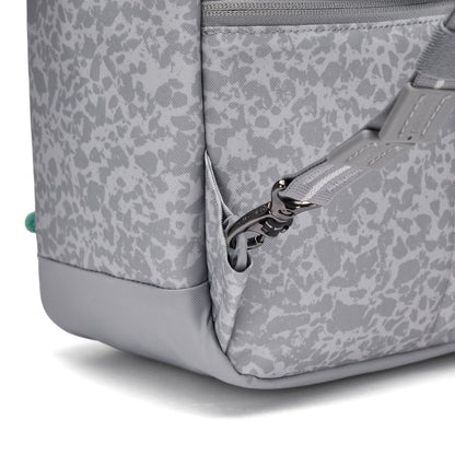 Close-up of the Pacsafe® GO 15L Anti-theft Backpack showing strap, RFID detail, and front pocket.