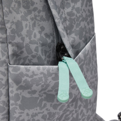 Close-up of the Pacsafe® GO 15L Anti-theft Backpack in gray with turquoise pulls and RFID blocking.