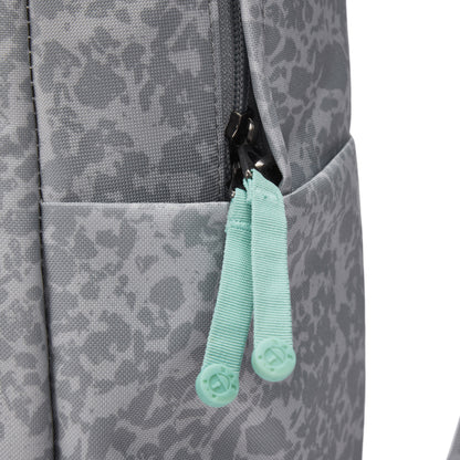 Close-up of Pacsafe® GO 25L Anti-theft Backpack in gray with mint green zipper pulls and side pocket.