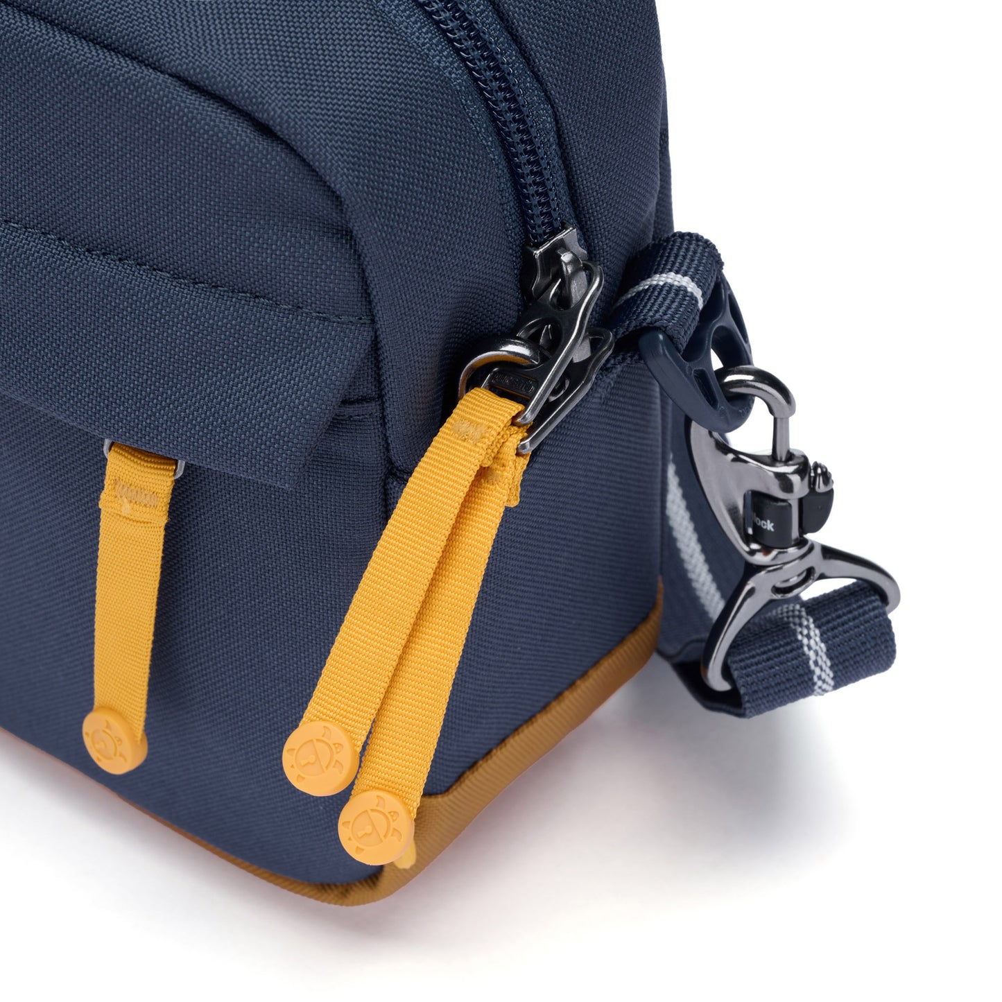 Pacsafe® GO Anti-Theft Crossbody Bag in coastal blue close up of shoulder strap attached to bag with the TurnNLock security hook.